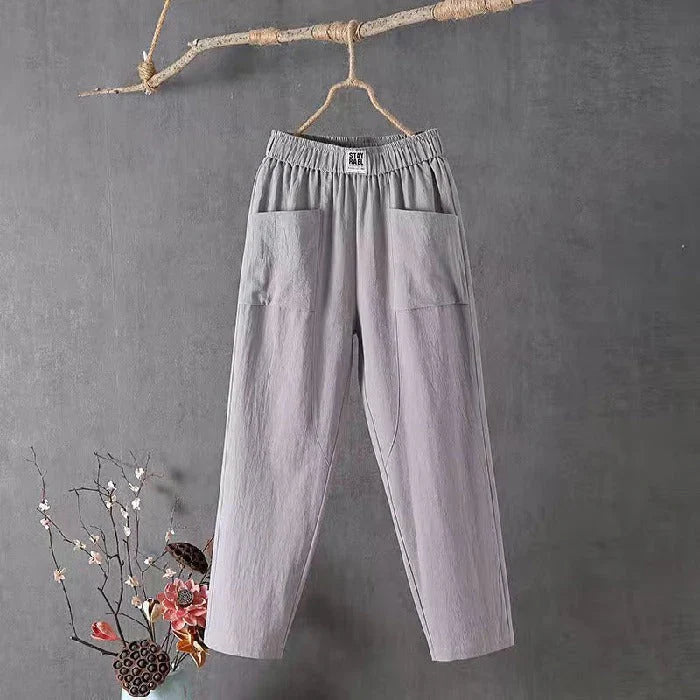 Straight-cut trousers with an elastic waistband and a simple design