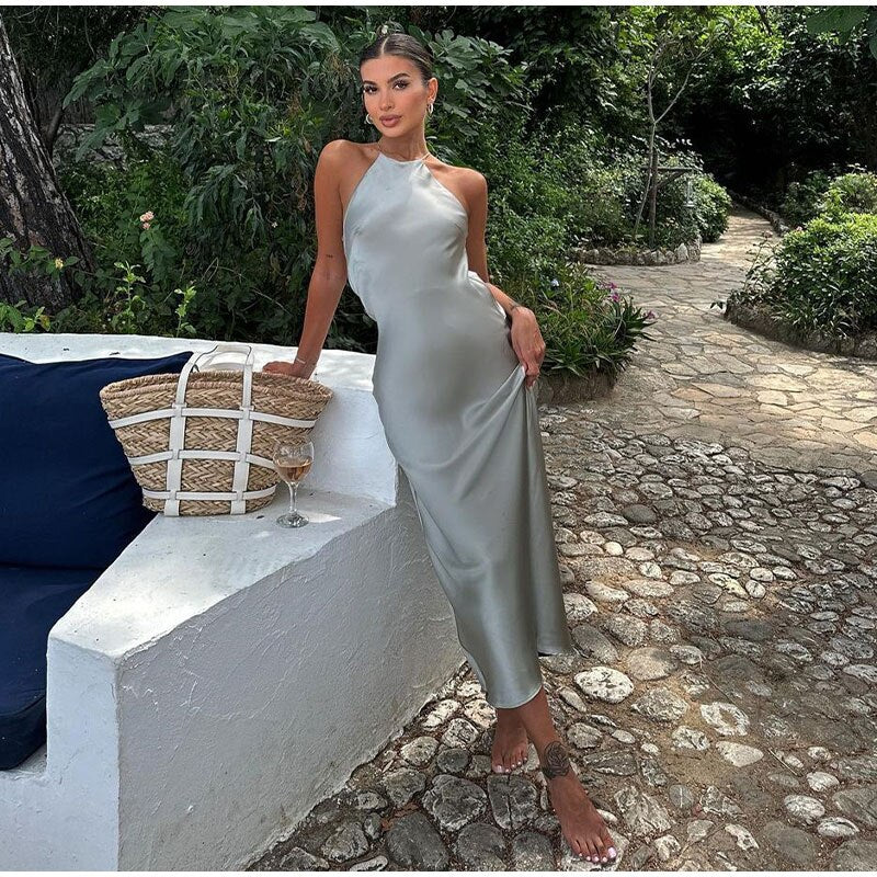 Long halter neck dress with back cutout and smooth surface