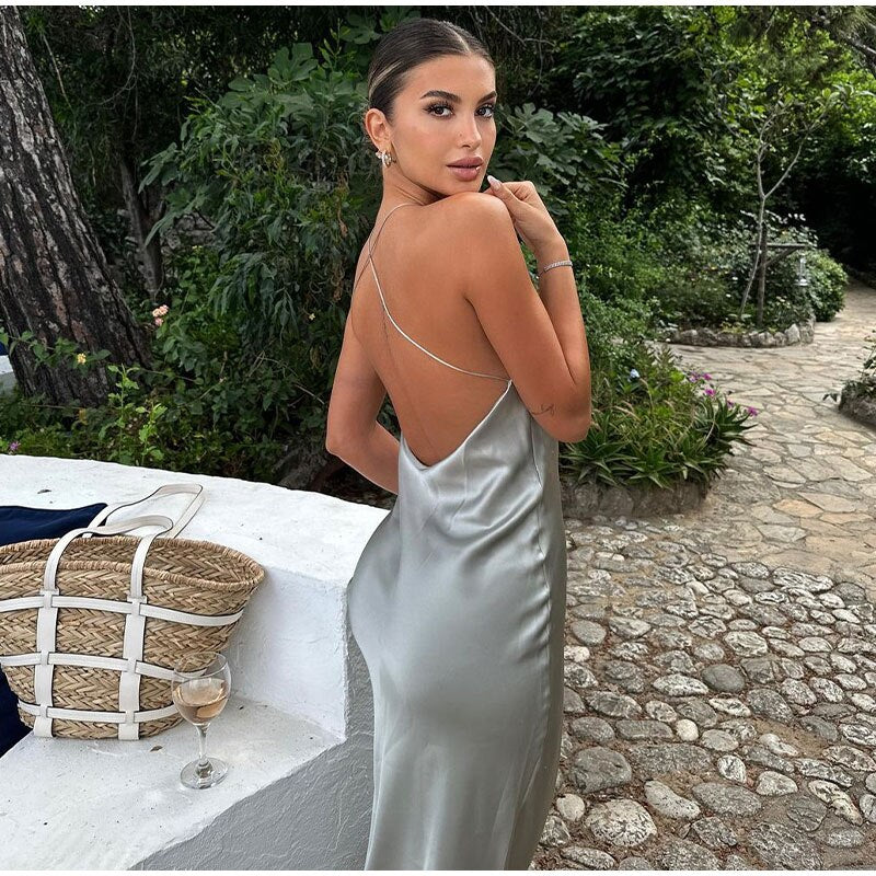 Long halter neck dress with back cutout and smooth surface