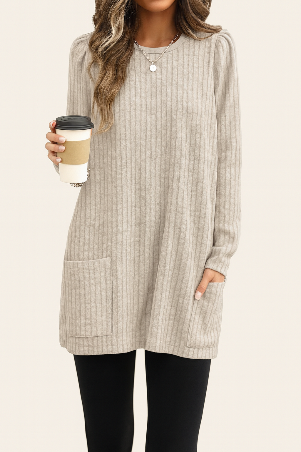Long knitted sweater with ribbed texture and front pocket