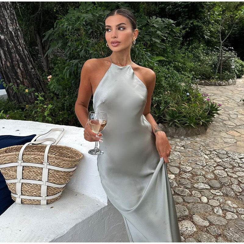 Long halter neck dress with back cutout and smooth surface