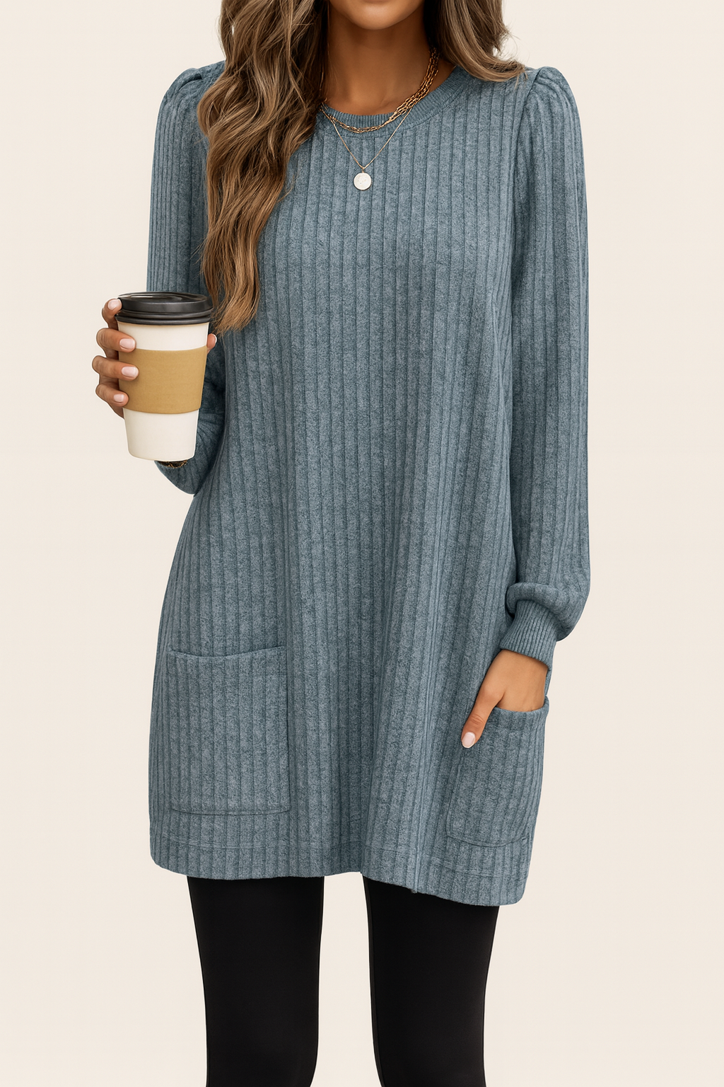 Long knitted sweater with ribbed texture and front pocket