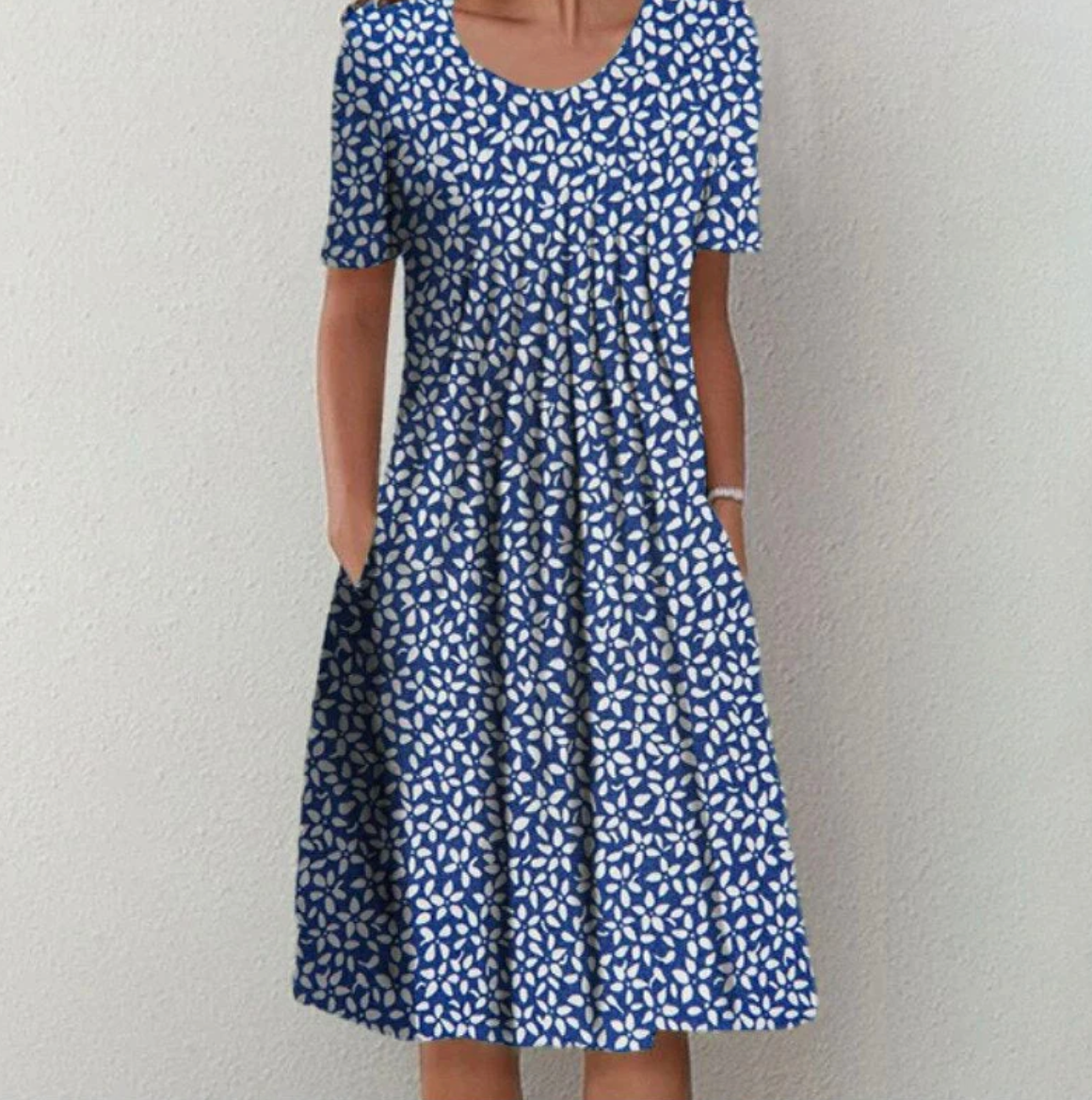 Knee-length women's dress with pattern and V-neck