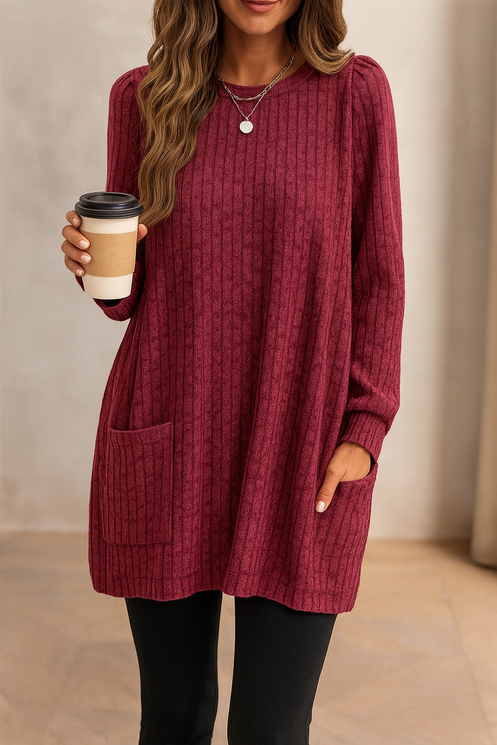 Long knitted sweater with ribbed texture and front pocket