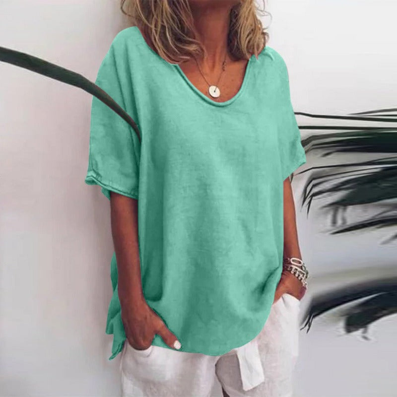 Loose-fitting women's blouse with round neck and tie details on the sleeves