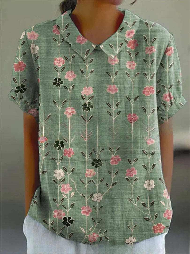 Short-sleeved blouse with button placket and floral pattern