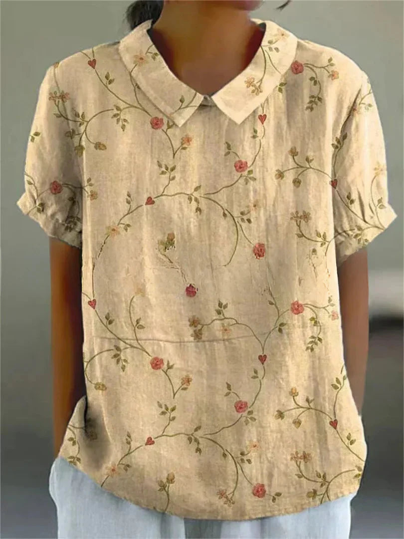 Short-sleeved blouse with button placket and floral pattern