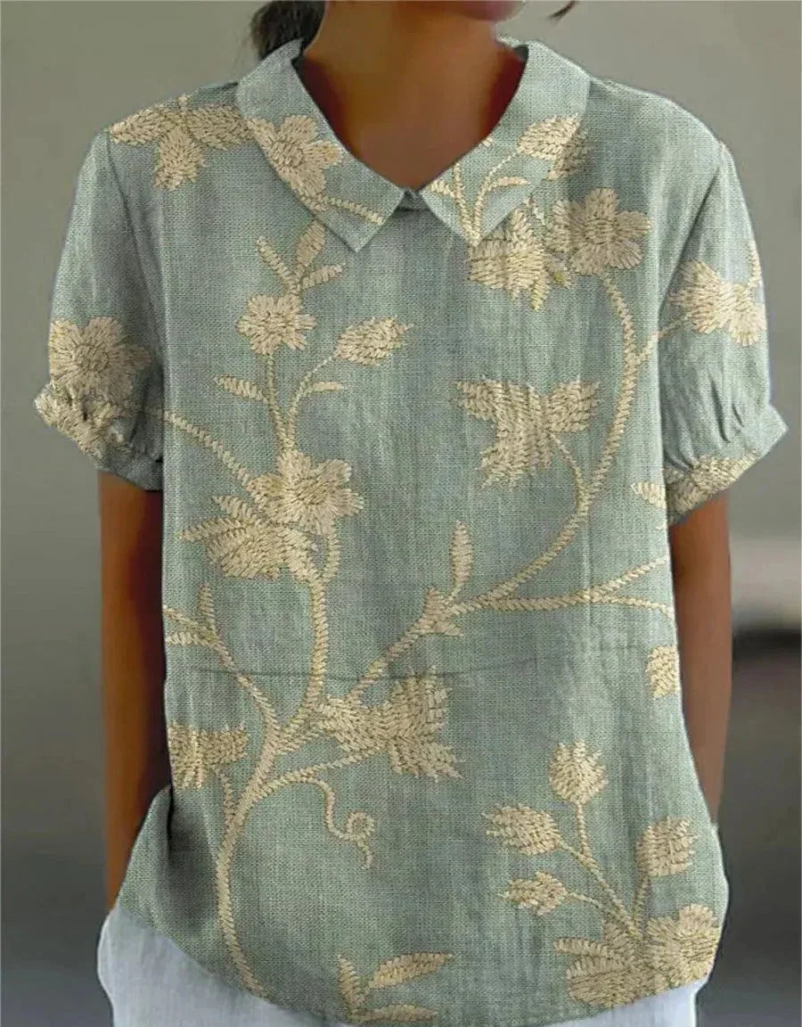 Short-sleeved blouse with button placket and floral pattern