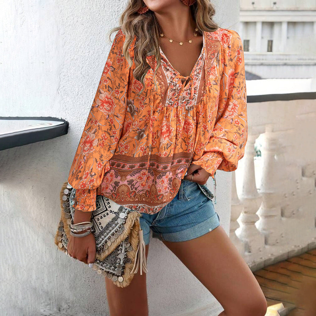 Women's blouse with V-neck, long sleeves and eye-catching pattern