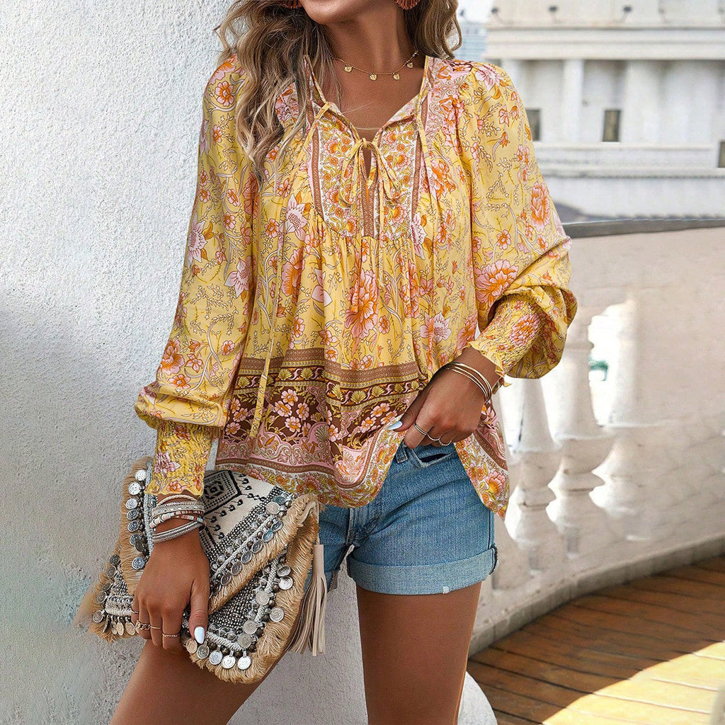 Women's blouse with V-neck, long sleeves and eye-catching pattern