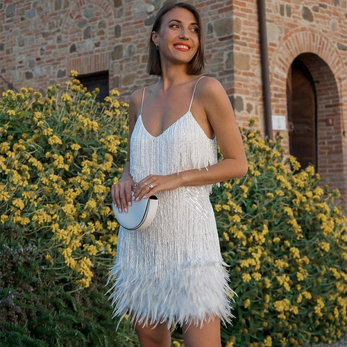 Evening dress with narrow straps and figure-hugging cut