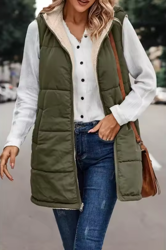 Long quilted vest with hood and button closure
