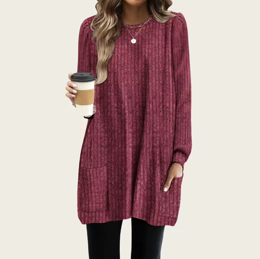 Long knitted sweater with ribbed texture and front pocket