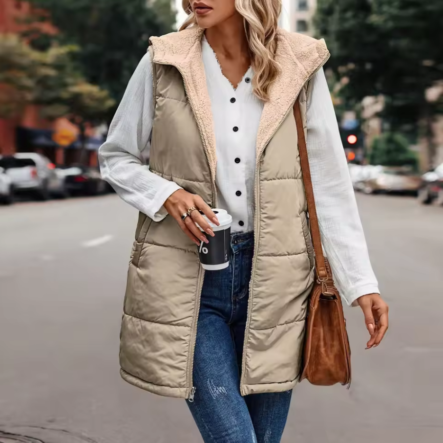 Long quilted vest with hood and button closure