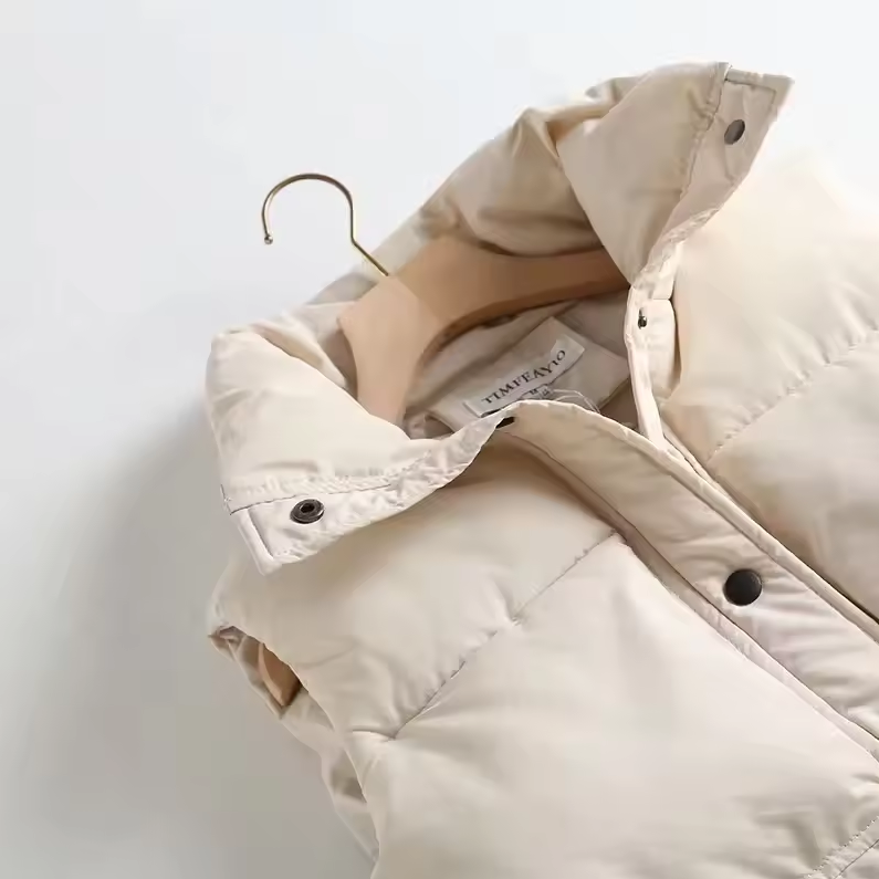 Padded quilted vest with detachable hood and button closure