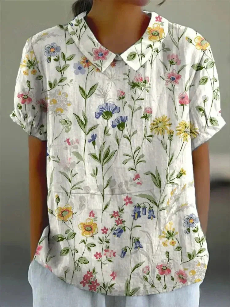 Short-sleeved blouse with button placket and floral pattern
