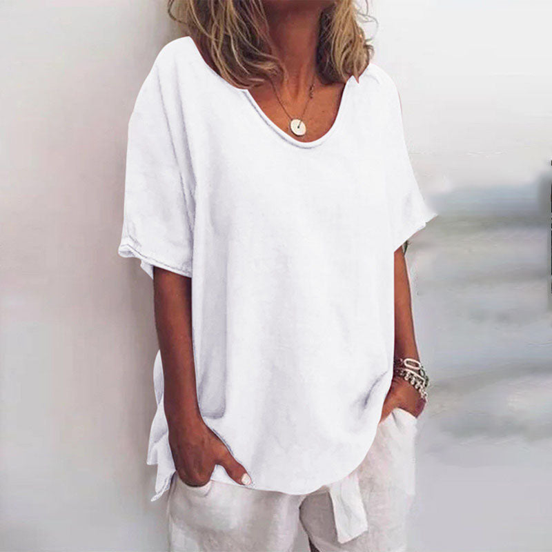 Loose-fitting women's blouse with round neck and tie details on the sleeves