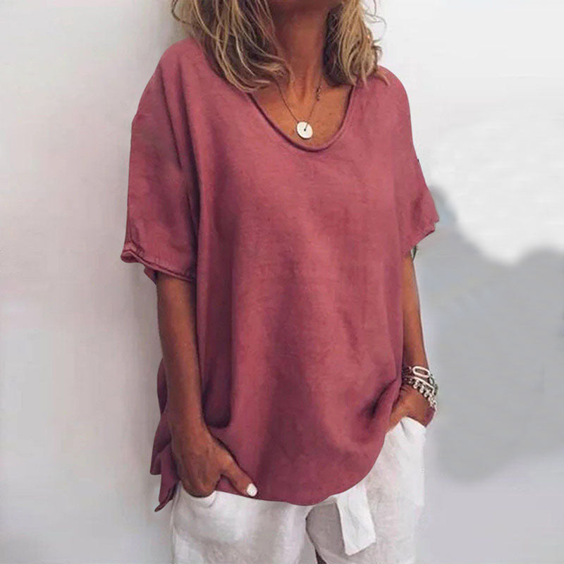 Loose-fitting women's blouse with round neck and tie details on the sleeves