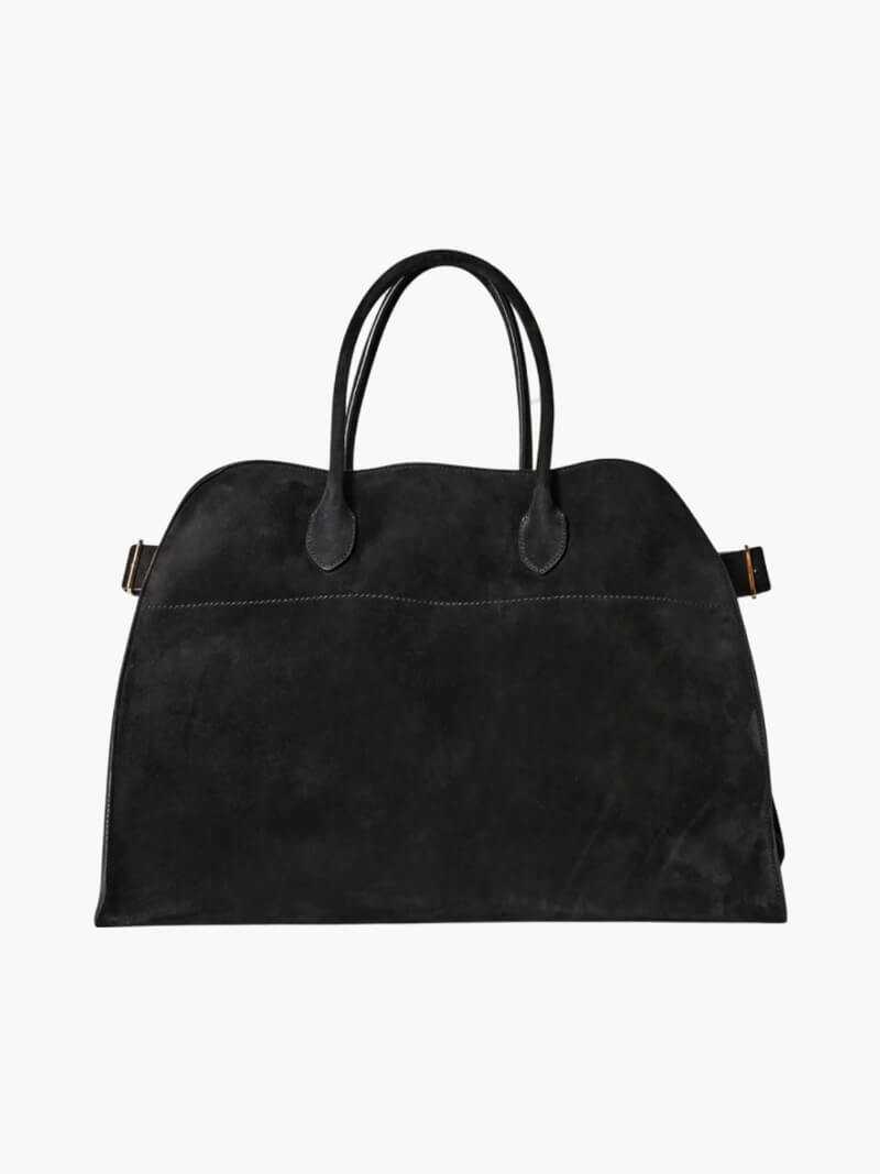 Handbag with textured material and zipper closure