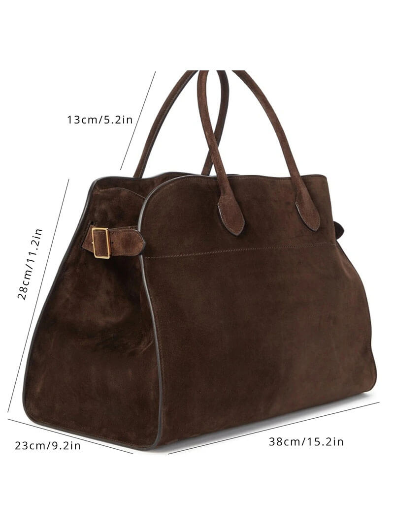 Handbag with textured material and zipper closure