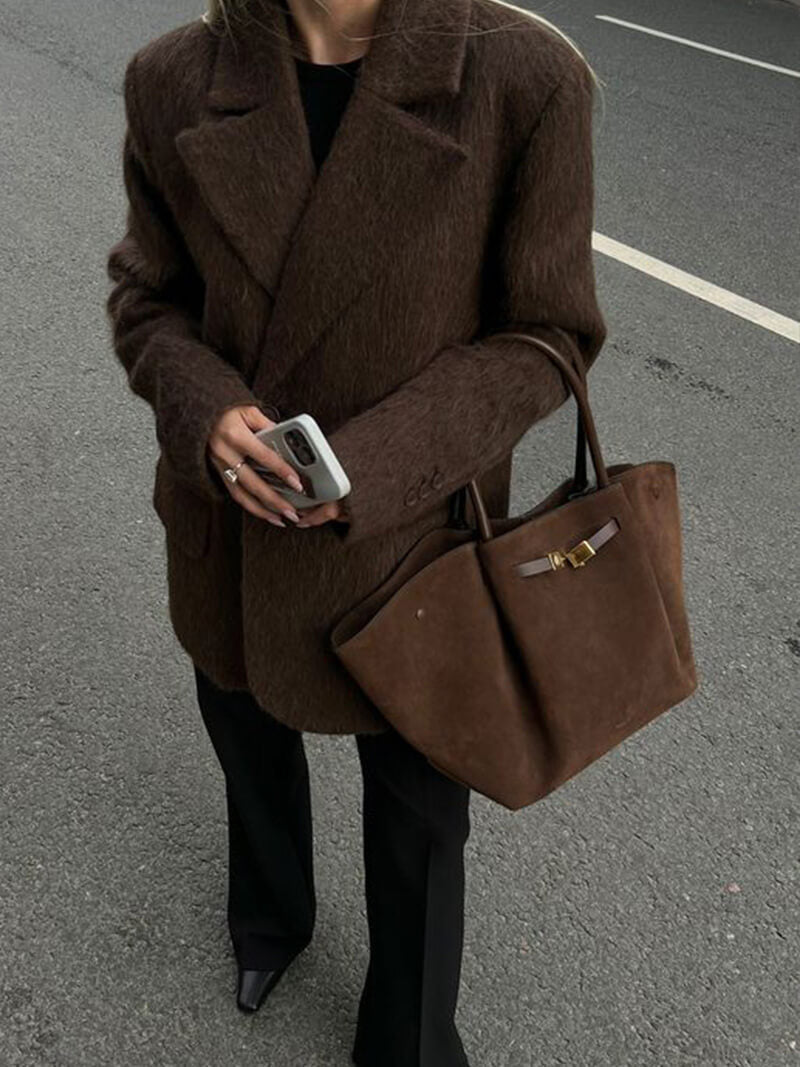 Handbag with handles, detachable strap, and structured design