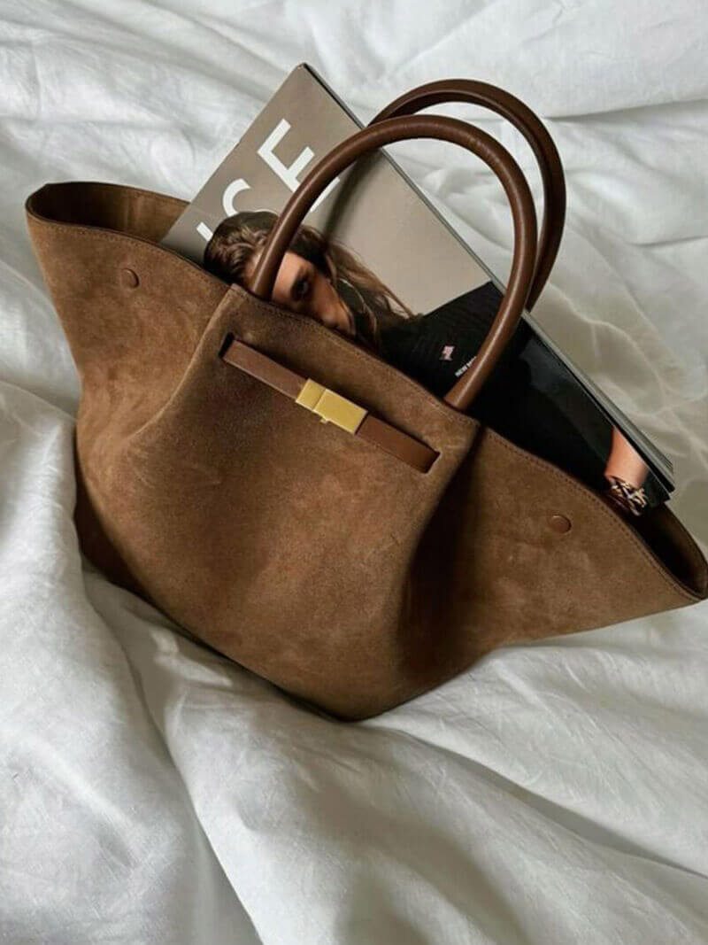 Handbag with handles, detachable strap, and structured design