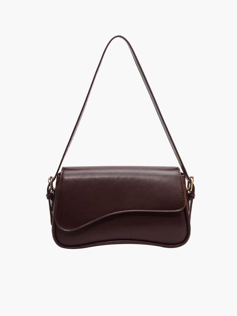 Compact shoulder bag with curved front detail and snap closure
