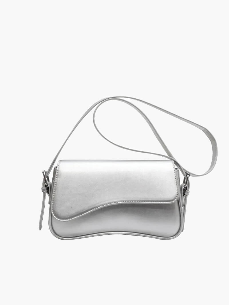 Compact shoulder bag with curved front detail and snap closure