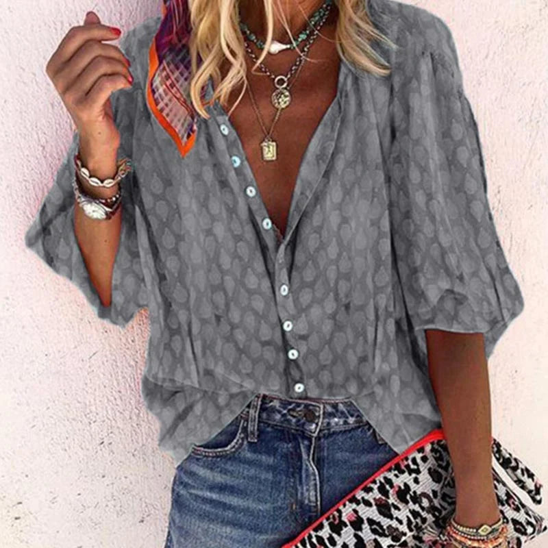 Women's blouse with pattern, button placket and V-neck